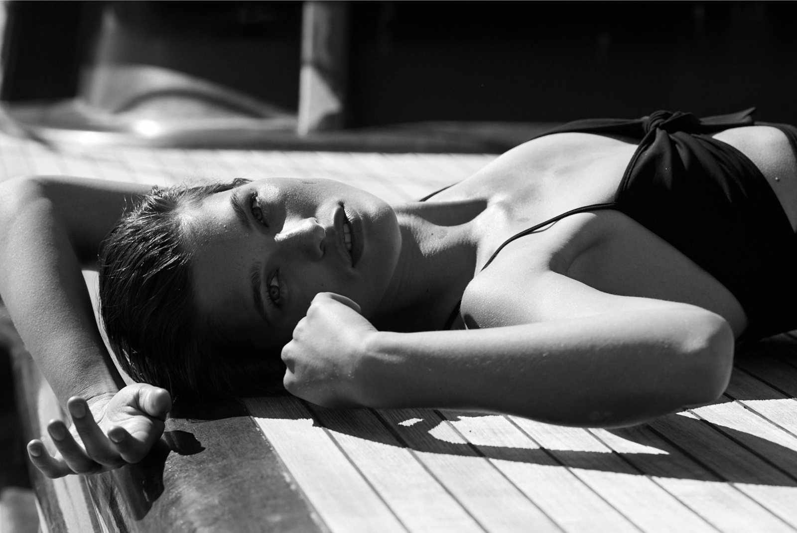 On the teak deck in the morning sun, photographed in black and white